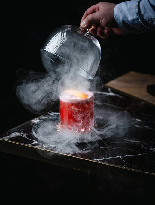 Smoky pink cocktail, served at Dans le Noir ? restaurant